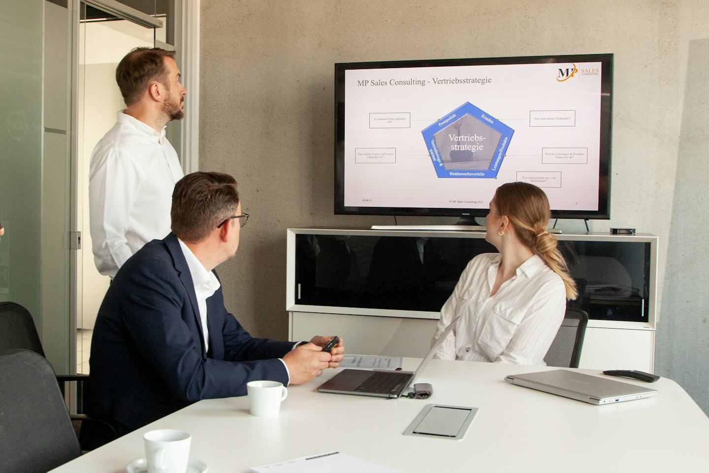 Business professionals in a conference room during a presentation.